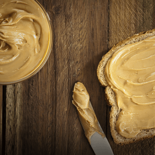 Peanut Butter Toast with Knife and Jar